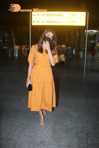 Actress Pooja Hegde in a Yellow Dress at the Airport