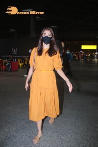 Actress Pooja Hegde in a Yellow Dress at the Airport