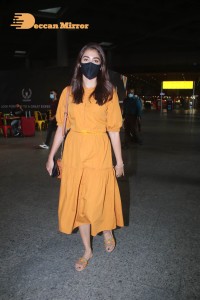 Actress Pooja Hegde in a Yellow Dress at the Airport