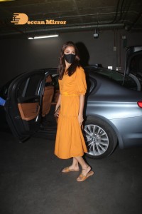 Actress Pooja Hegde in a Yellow Dress at the Airport