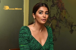Pooja Hegde in a green dress