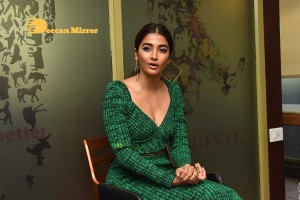 Pooja Hegde in a green dress