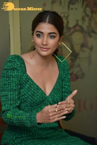 Pooja Hegde in a green dress