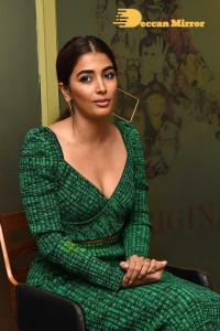 Pooja Hegde in a green dress