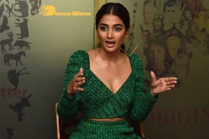 Pooja Hegde in a green dress