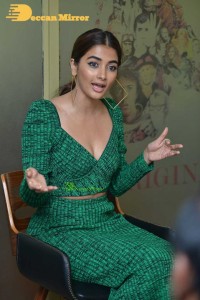 Pooja Hegde in a green dress
