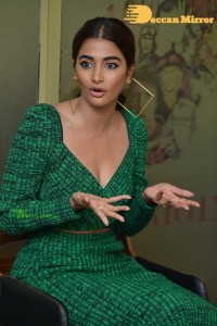 Pooja Hegde in a green dress