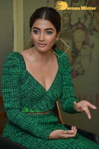 Pooja Hegde in a green dress