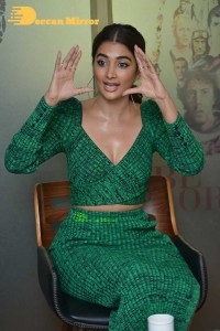 Pooja Hegde in a green dress