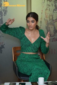 Pooja Hegde in a green dress