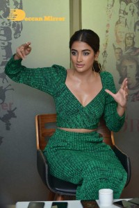 Pooja Hegde in a green dress