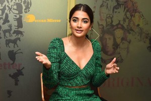 Pooja Hegde in a green dress
