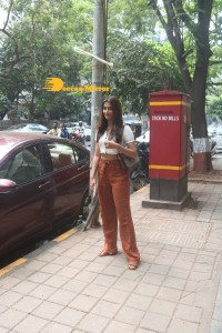 Pooja Hegde in a white top and brown pants