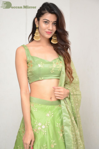 Telugu Actress Pooja Solanki in a green dress