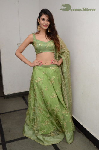 Telugu Actress Pooja Solanki in a green dress