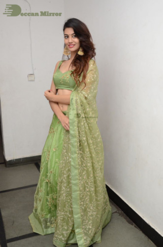 Telugu Actress Pooja Solanki in a green dress