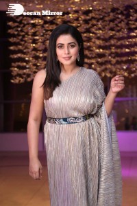 South Actress Poorna in a grey shiny dress