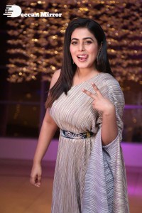 South Actress Poorna in a grey shiny dress