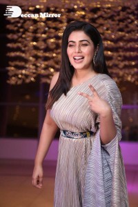 South Actress Poorna in a grey shiny dress