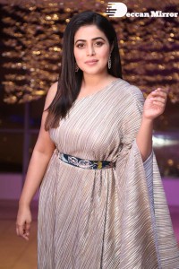 South Actress Poorna in a grey shiny dress
