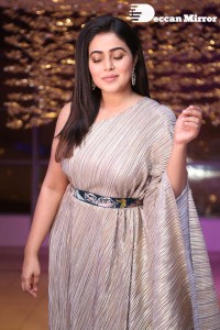 South Actress Poorna in a grey shiny dress