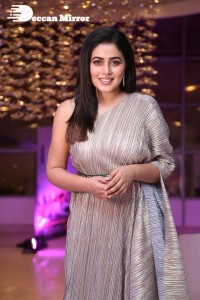 South Actress Poorna in a grey shiny dress