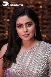 South Actress Poorna in a grey shiny dress
