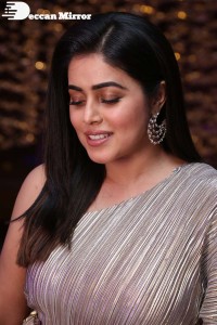 South Actress Poorna in a grey shiny dress