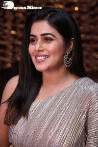 South Actress Poorna in a grey shiny dress