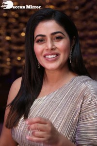 South Actress Poorna in a grey shiny dress