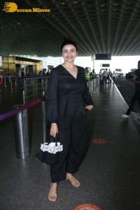 Actress Prachi Desai seen in a black dress at the Mumbai Airport
