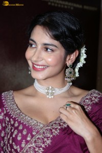 actress Pragati Srivastava dazzles in a maroon saree at a movie event