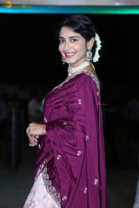 actress Pragati Srivastava dazzles in a maroon saree at a movie event