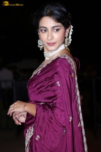 actress Pragati Srivastava dazzles in a maroon saree at a movie event