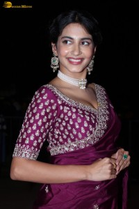 actress Pragati Srivastava dazzles in a maroon saree at a movie event