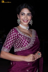 actress Pragati Srivastava dazzles in a maroon saree at a movie event