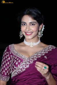 actress Pragati Srivastava dazzles in a maroon saree at a movie event