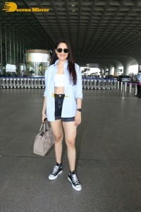 Pragya Jaiswal in a shirt and denim shorts at Mumbai Airport