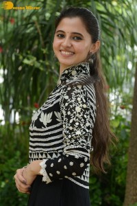Tollywood actress preethi asrani in a black and white dress