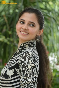 Tollywood actress preethi asrani in a black and white dress