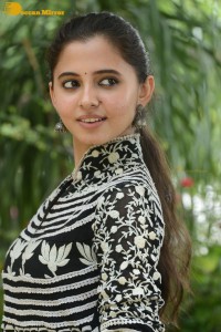 Tollywood actress preethi asrani in a black and white dress