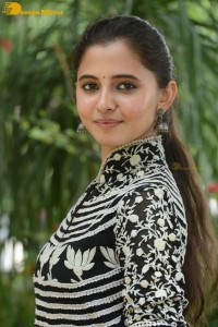 Tollywood actress preethi asrani in a black and white dress