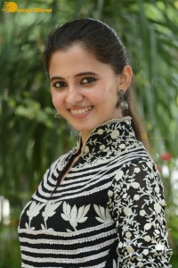 Tollywood actress preethi asrani in a black and white dress