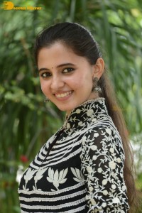 Tollywood actress preethi asrani in a black and white dress