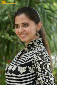 Tollywood actress preethi asrani in a black and white dress