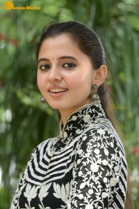 Tollywood actress preethi asrani in a black and white dress