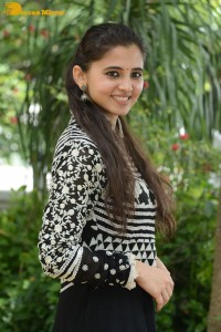 Tollywood actress preethi asrani in a black and white dress