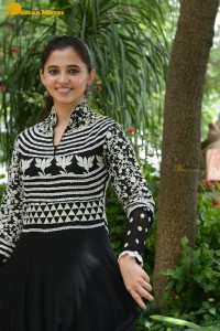 Tollywood actress preethi asrani in a black and white dress