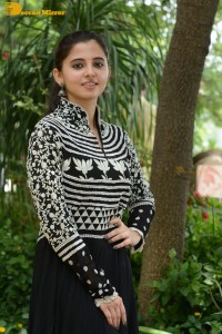 Tollywood actress preethi asrani in a black and white dress