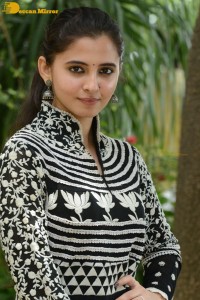 Tollywood actress preethi asrani in a black and white dress